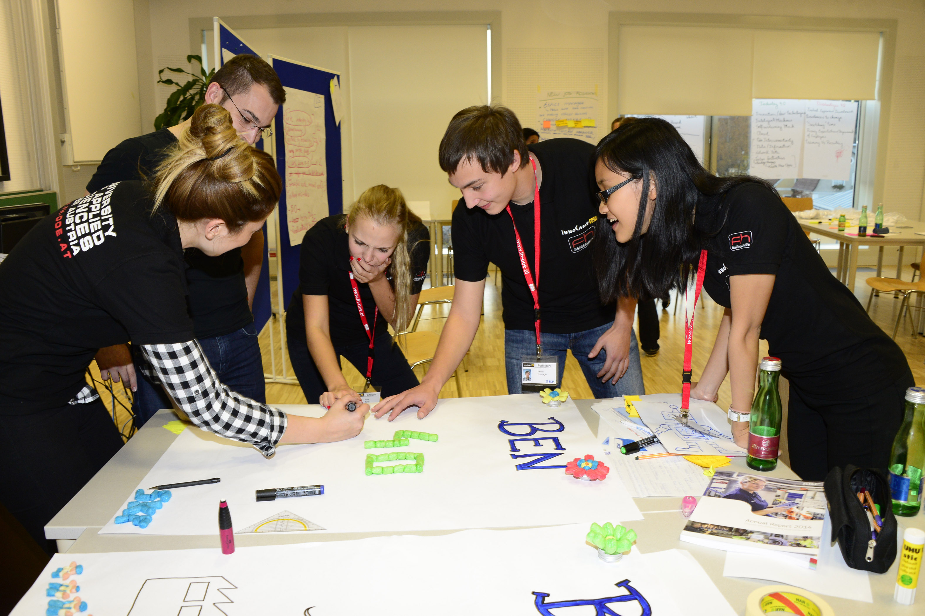 A group of students creating a flipchart for the Innocamp